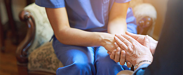 Doctor comforting patient