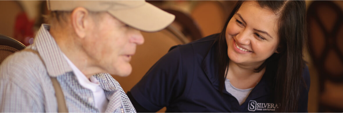 Female staff member assisting a patient